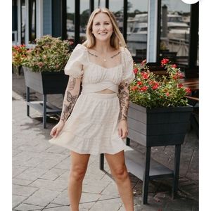 Ivory dress with puff sleeves and tiered skirt